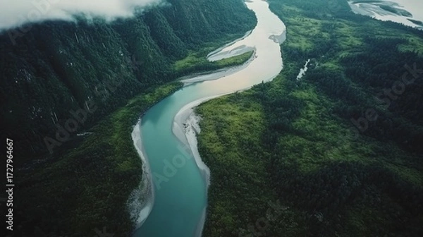 Obraz Aerial View of a Serene River Flowing Through Lush Green Mountains