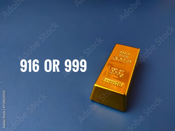Fototapeta The image presents a question about gold purity 916 OR 999, alongside a gold bar on a blue background