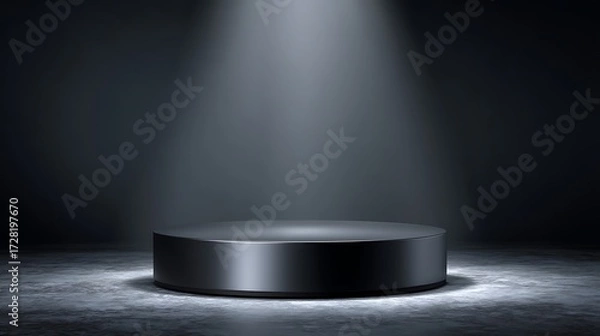 Fototapeta Matte black podium at bottom center with spotlight highlighting small metallic surface, dark gradient background and blank space, designed for luxury tech display and modern advertising concepts.
