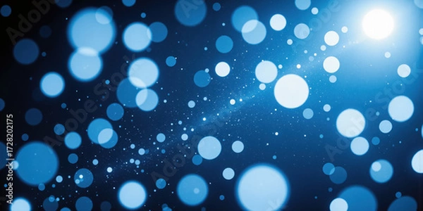 Fototapeta Snowflakes Falling on Blue Background Delicate, white snowflakes fall gently against a vibrant blue background, close-up, shallow depth of field