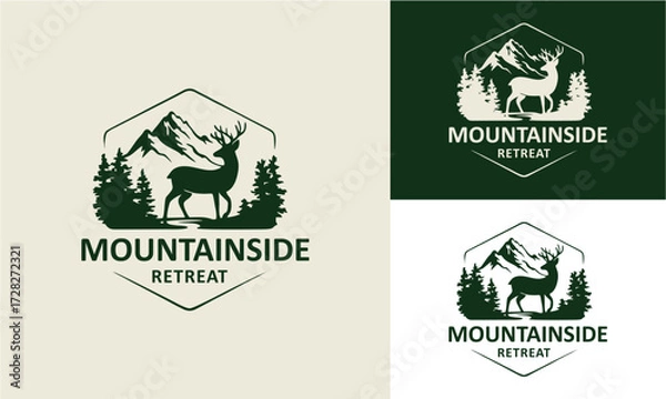 Fototapeta vintage logo of a deer standing against a mountain background