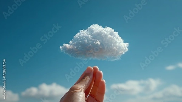 Fototapeta Hand Holding a Miniature Cloud Against a Blue Sky. A Symbolic Gesture of Creativity and Imagination in a Clear and Serene Setting.