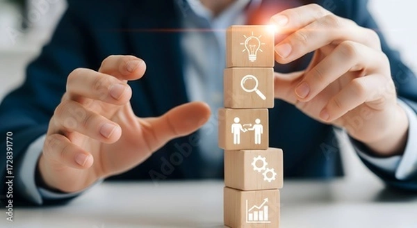 Fototapeta Businessman stacking blocks consultant concept