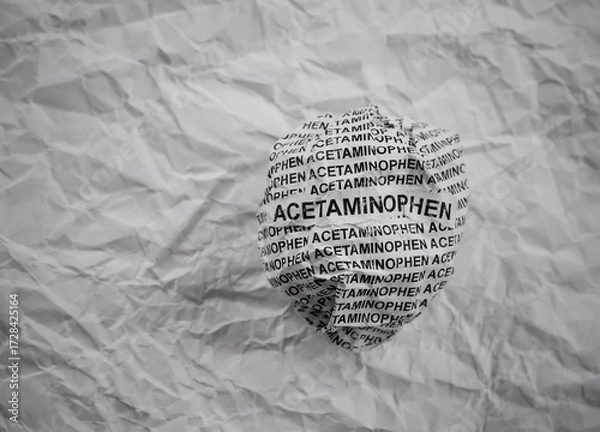 Fototapeta Crumpled paper ball with words Acetaminophen on a crumpled white paper background.