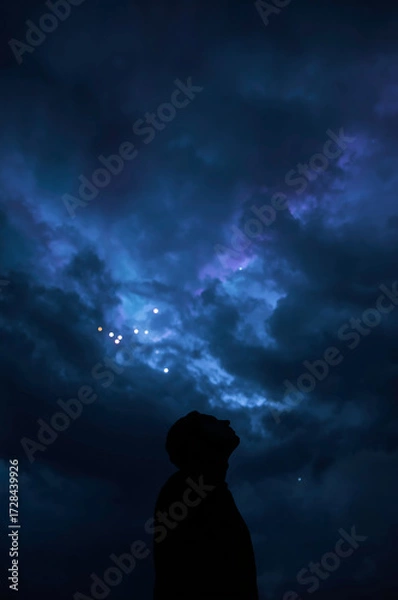 Obraz Strange lights in the cloudy night sky—eerie and dramatic.