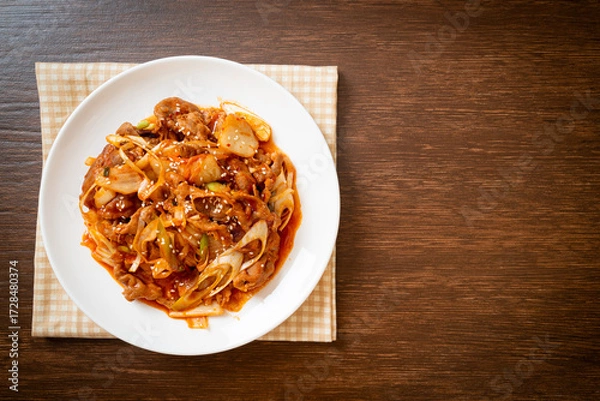 Fototapeta stir-fried pork with Korean spicy paste and kimchi