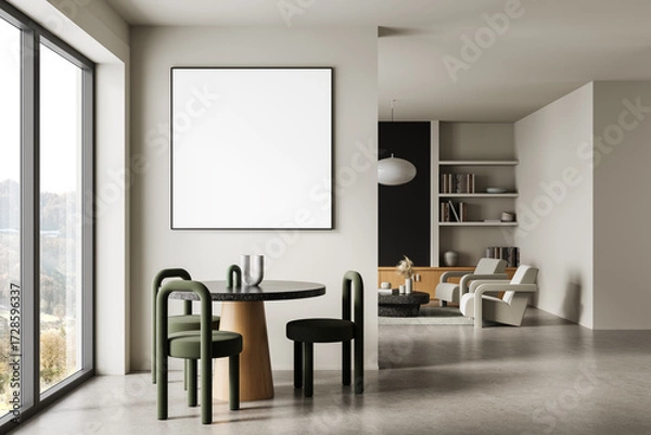 Fototapeta Modern interior with round dining table, green chairs, and large blank wall poster in minimal living room with natural light and bookshelf decor. 3D Rendering