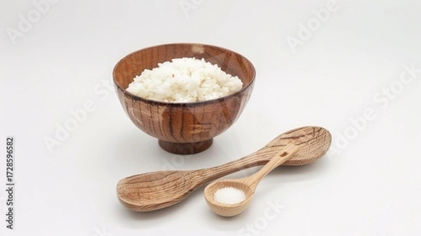 Fototapeta Rice, Wooden Spoon, and Bowl – a warm and rustic composition. The natural textures and earthy tones create a cozy, homey kitchen atmosphere.