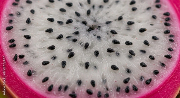 Fototapeta Dragon fruit sliced, macro detail of seeds and vibrant color