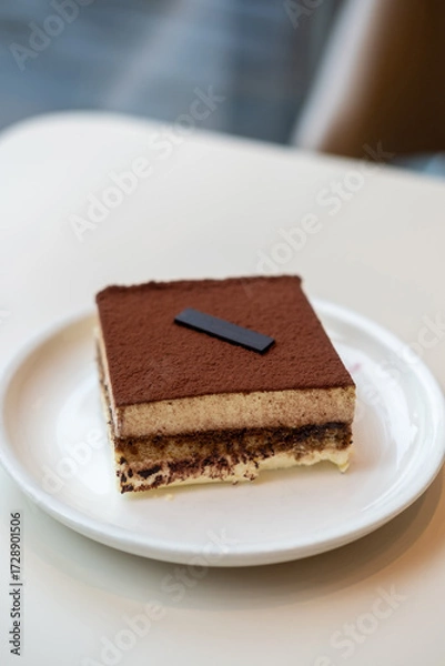 Fototapeta Square Tiramisu served on plate in the cafe