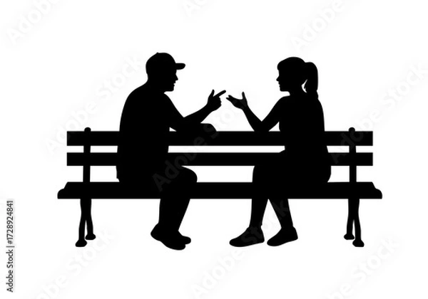 Fototapeta Silhouette of a Couple engaged in conversation on a park bench