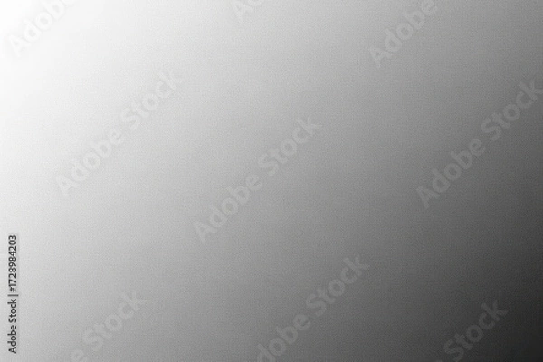 Fototapeta A smooth monochrome gray gradient texture background with subtle grain, transitioning from bright white to dark black, offering versatile design copy space.