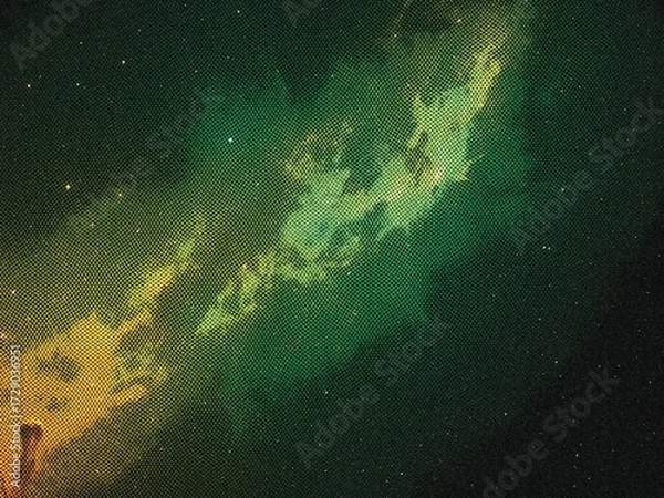 Fototapeta A vibrant, abstract depiction of a nebula in space, showcasing swirling clouds of green and yellow gas against a dark backdrop.