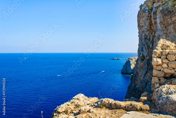 Obraz The Acropolis of Lindos rocks and walls on a sea background, Rhodes,  Greece