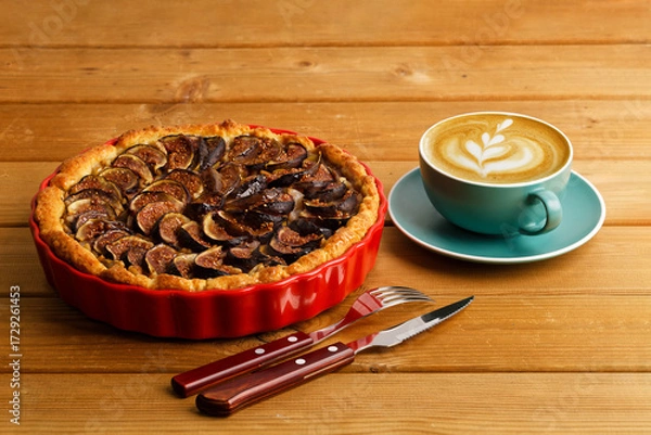 Fototapeta Homemade pie with pears and figs on wooden table.