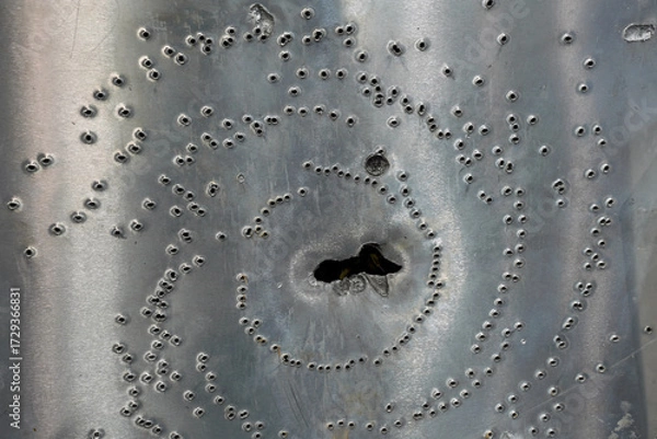 Obraz Thick steel plate with holes from firing different ammo types after ballistic penetration test