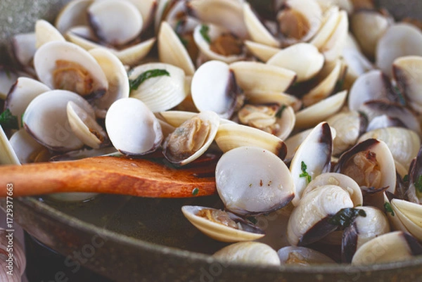 Obraz cooking, vongole clams, in a pan with spices and white wine, top view, no people,