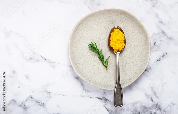 Obraz Yuzu caviar is pearly, on a spoon, top view, light background, no people.
