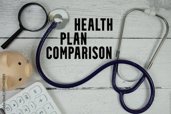 Obraz Health Plan Comparison text with Stethoscope and magnifying glass on wooden background