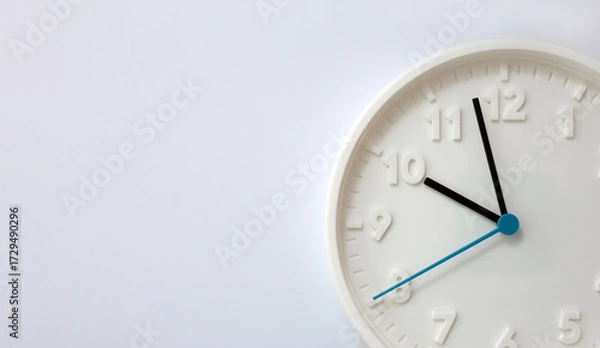 Fototapeta Fragment of clock dial on white background. Concept of human aging and the passage of time. Selective focus and copy space
