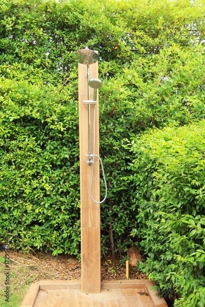 Fototapeta Outdoor shower with nature by the pool