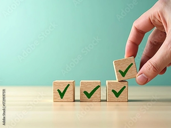Fototapeta Task completion and project management success. Hand stacking wooden blocks with green checkmark icons for a checklist