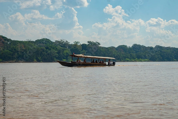 Fototapeta The Madre de Dios River, gateway to the Amazon rainforest of Madre de Dios, where the most biodiverse Amazon forests of Peru are found, and where the Tambopata National Reserve is located