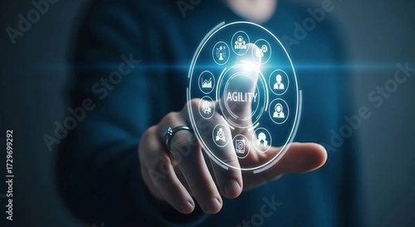 Fototapeta Person touching a futuristic interface displaying agility icons and word business concept