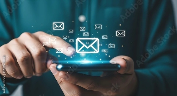 Fototapeta Person using smartphone with email icons and glowing effect message communication