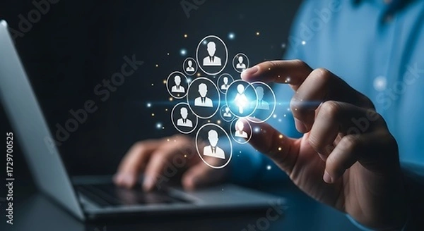 Fototapeta Person's fingers interacting with a glowing network of user profile icons technology