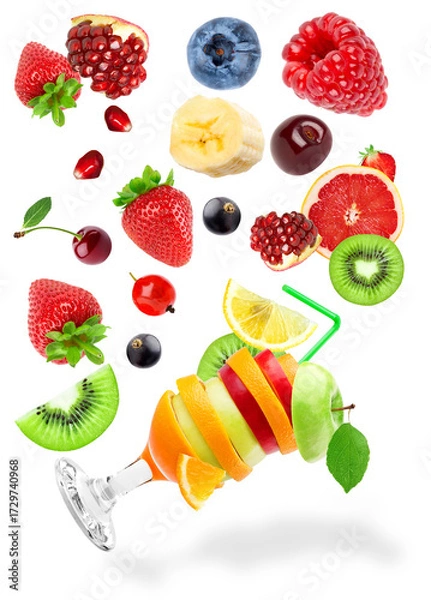 Fototapeta dynamic composition of various healthy fruits including a creative cocktail glass, scattered on black