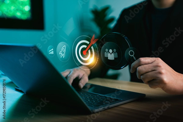 Fototapeta Business analysis and target audience strategy with businessman using laptop computer and magnifying glass focusing on digital marketing goal surrounded by growth chart, teamwork and search innovation