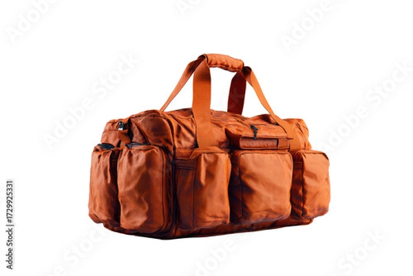 Fototapeta A large orange bag with a black strap sits on a white background. The bag has a lot of pockets and seems to be designed for carrying many items