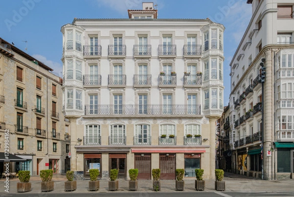 Fototapeta Traditional Basque Architecture With White Glass Enclosed Balconies And Wrought Iron Details In Northern Spain. Historic Building, Urban Architecture