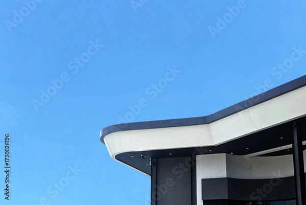 Fototapeta Modern Building Architecture Against Blue Sky.
