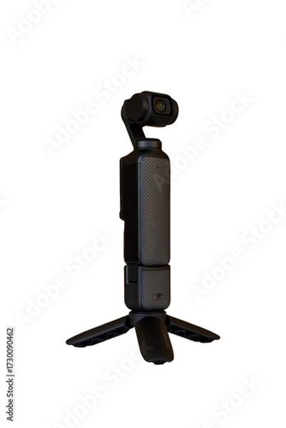Fototapeta Compact Handheld Gimbal Camera Mounted on Mini Tripod on Wooden Table with Blurred Background.