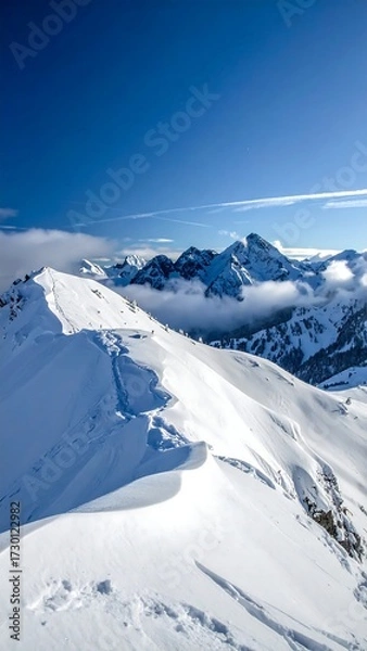 Obraz Snowy mountain peaks under a clear sky