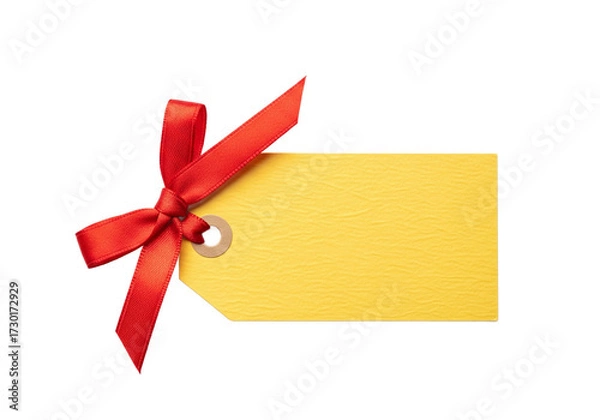 Fototapeta A bright yellow gift tag with a vibrant red satin ribbon tied in a bow isolated on a stark black background perfect for adding a personal touch to presents
