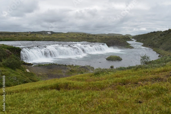Fototapeta Waterfall on the river in cloudy weather, nature and landscape