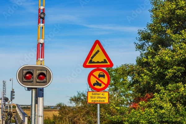 Fototapeta Close-up view of Swedish traffic signs warning of drawbridge with prohibition for cars and motorcycles. Sweden.