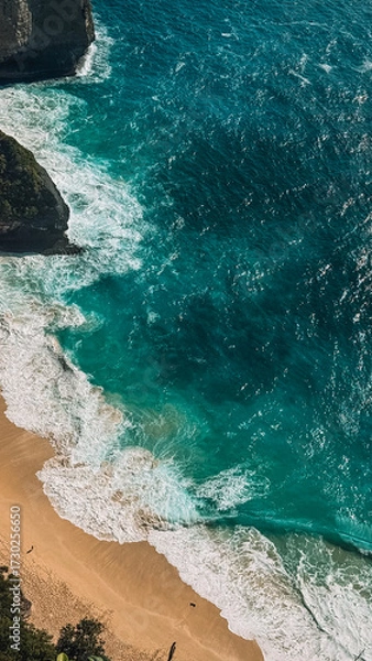 Obraz Aerial view of the turquoise ocean near Bali and Nusa Penida. Clear water, bright sunlight, and vibrant coastal tones showing the beauty of the tropical seascape from above.