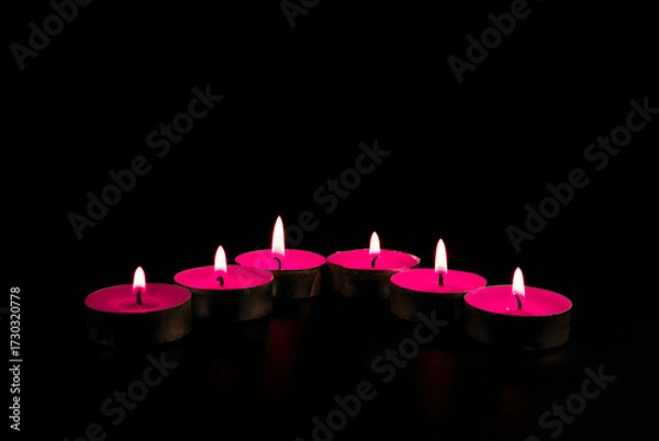 Obraz candles on a red background