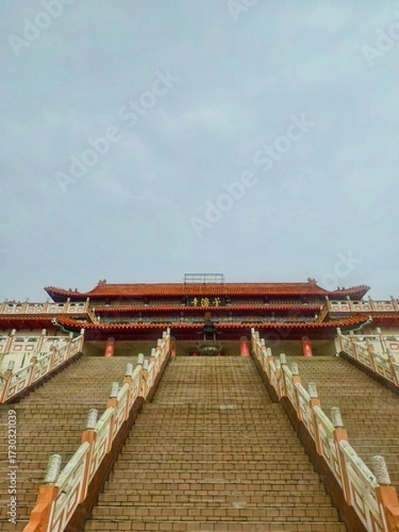 Fototapeta Puu Jih Shih Buddhist Temple With Grand Staircase, Red Roofs, Ornate Carvings and Lanterns