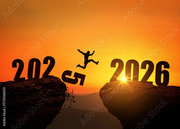 Fototapeta Man jumping on cliff 2026 over the precipice with stones at amazing sunset. New Year's concept. 2025 falls into the abyss. Welcome 2026. People enters the year 2026, creative idea.