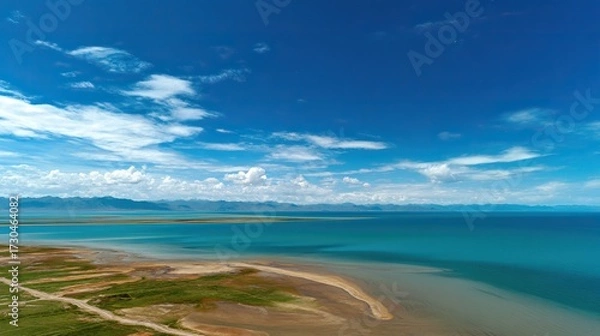 Fototapeta From a panoramic perspective, overlooking the vast lake, the deep blue water contrasts sharply with the expansive desert landscape, showcasing the natural beauty of the area.