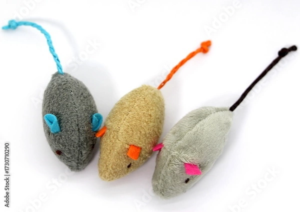 Fototapeta Three very cute soft mice toys for a cat isolated on white background. Top view