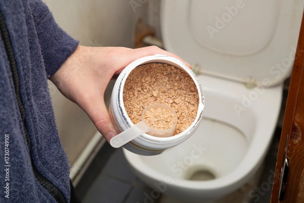 Fototapeta Bacteria for septic tanks and cesspools are poured through the toilet.