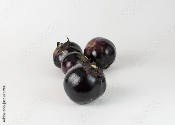 Obraz Four round eggplant on a white background