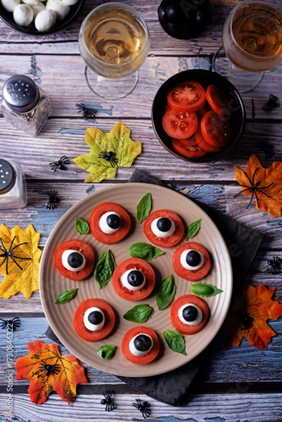 Fototapeta Caprese salad in the form of eyes of monster in a plate for Halloween holidays