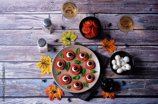 Fototapeta Caprese salad in the form of eyes of monster in a plate for Halloween holidays